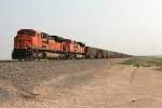 BNSF power pushing loaded coal train